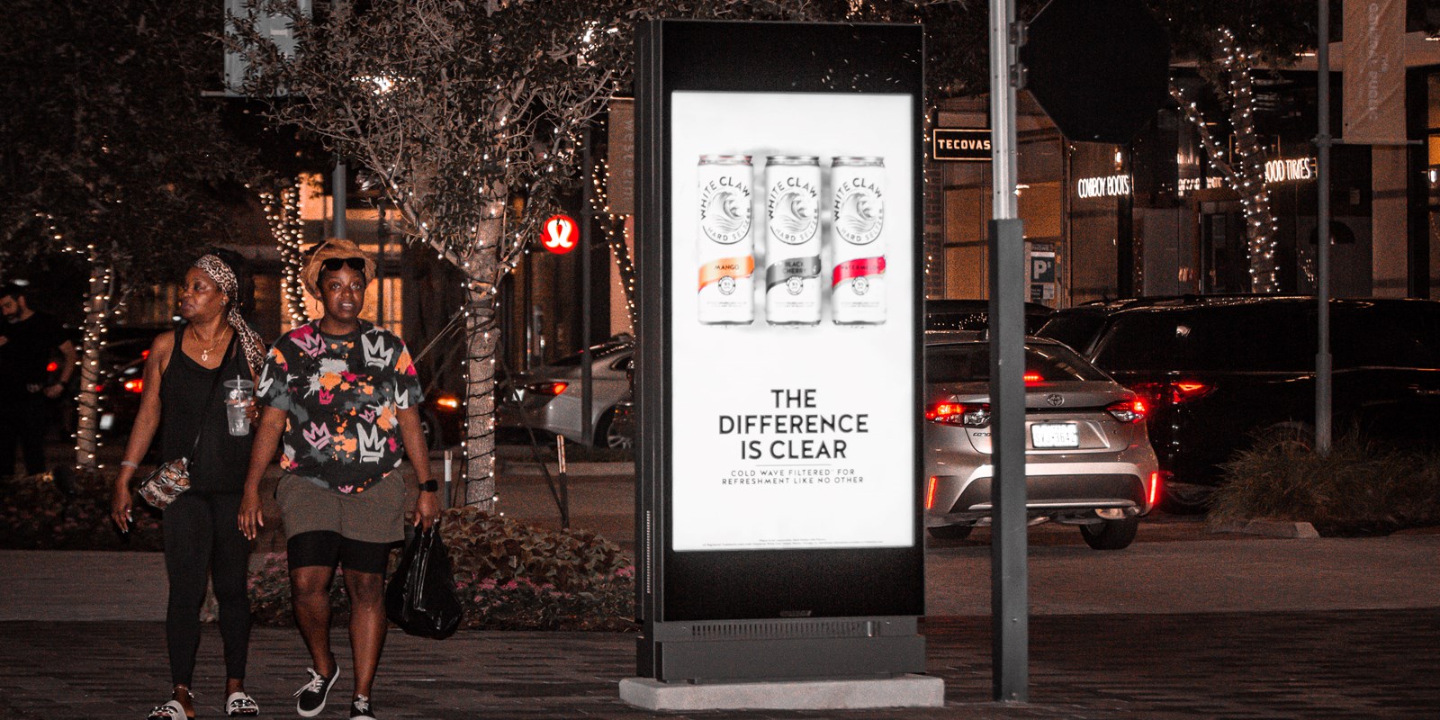 two pedestrians with Placard VP Houston CityCentre