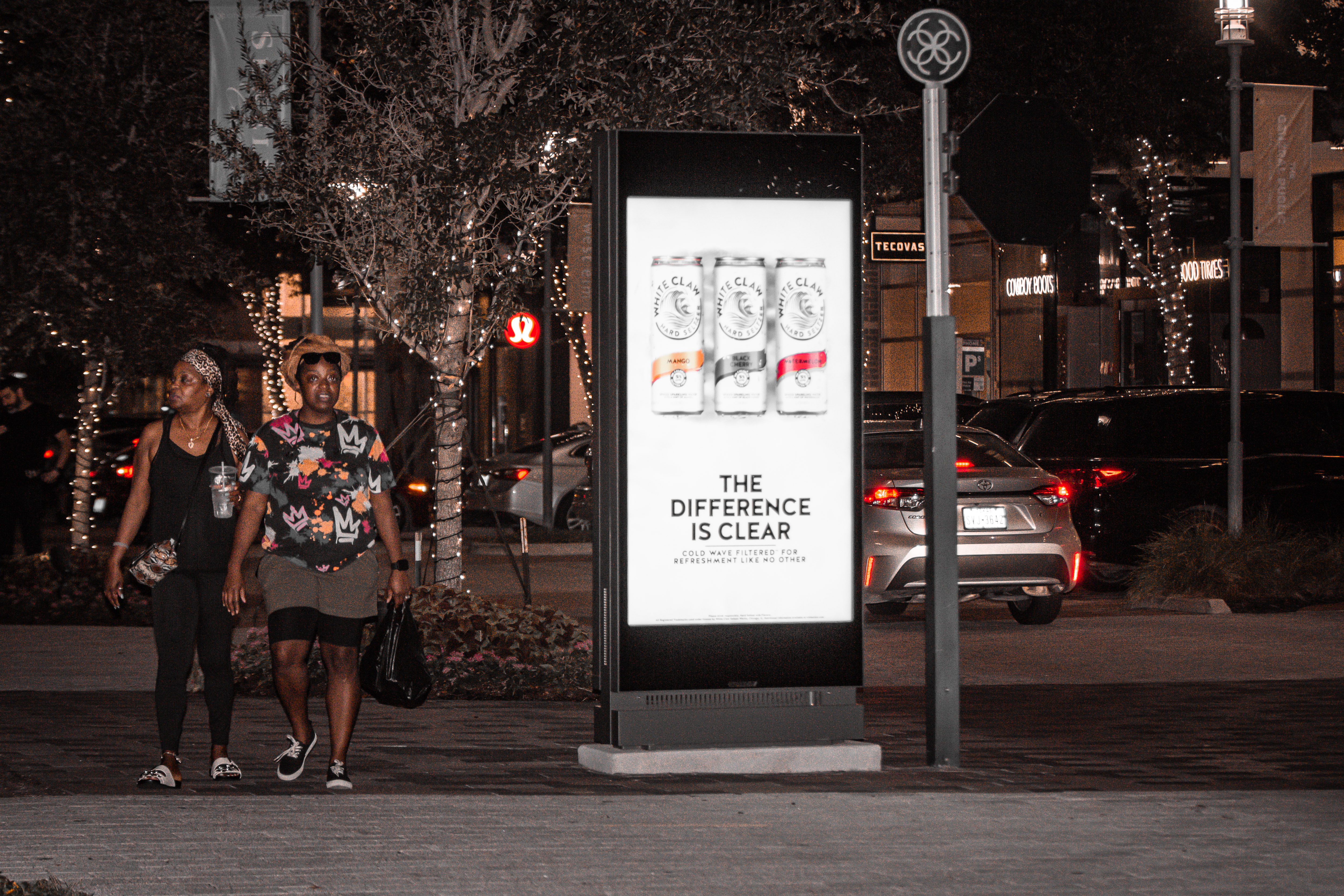 two pedestrians with Placard VP Houston CityCentre